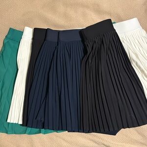 Three Varsity High-Rise Pleated
Tennis Skirt and One Pleated
Tennis Skirt (14)